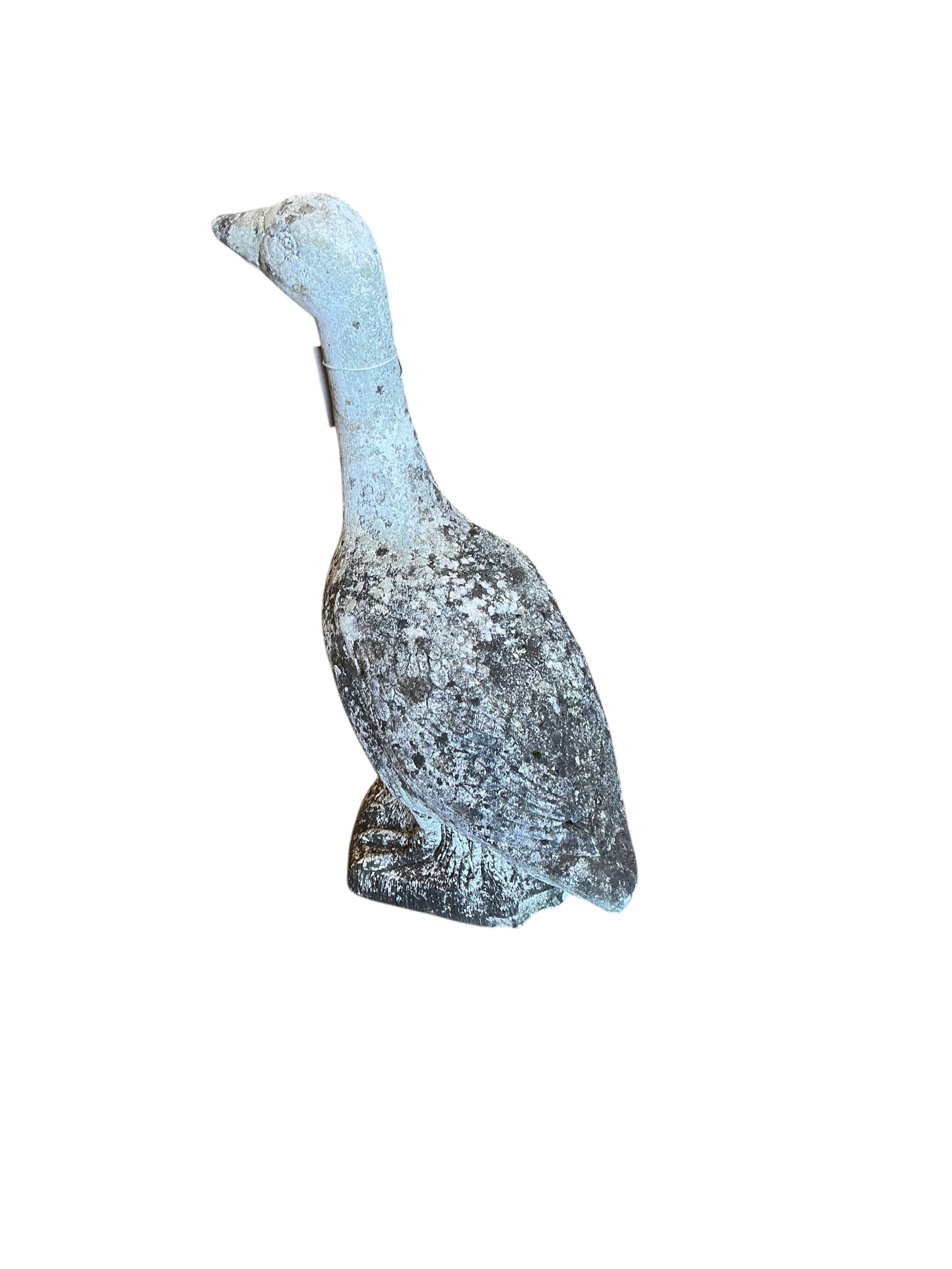 A reconstituted stone goose garden ornament, height 57cm